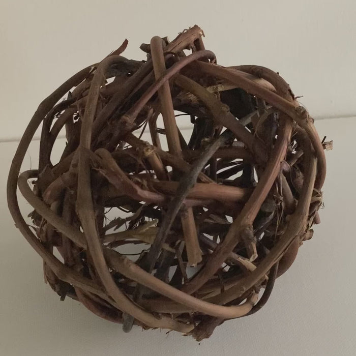 Ball made of grapevine with a white background